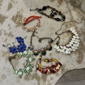 7 necklaces and 1 pair of earrings